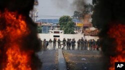 Bolivarian National Guard troops man a barricade blocking access to the Francisco De Paula Santander international bridge in Urena, Venezuela, on the border with Colombia, Feb. 23, 2019.