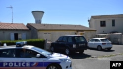 A police vehicle is pictured outside the home of Guy S., alleged leader of a group linked with the ultra-right Operational Forces Action, June 25, 2018, in Tonnay-Charente, a commune in southwest France. Guy S. and nine others were arrested in connection with an alleged plot to attack Muslims in France. 