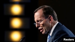 Australian Prime Minister Tony Abbott delivers his keynote speech during the B20 Summit in Sydney, July 17, 2014.