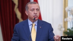 FILE - Turkey's President Recep Tayyip Erdogan speaks at a joint media briefing with Indonesia's President Joko Widodo at the presidential palace in Jakarta, Indonesia, July 31, 2015.