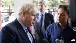 Britain's Foreign Secretary Boris Johnson speaks with reporters while visiting the Yangon General Hospital in Yangon, Myanmar, Jan. 21, 2017.