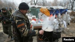 A schoolgirl runs past a burning barricade in Kibera slum in Nairobi, Kenya, during a demonstration of opposition supporters protesting for a change of leadership ahead of next year&#39;s election.