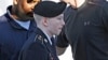 Army Pfc. Bradley Manning is escorted into a courthouse at Fort Meade, Md., June 4, 2013.