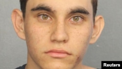Nikolas Cruz appears in a police booking photo after being charged with 17 counts of premeditated murder following a Parkland school shooting, at Broward County Jail in Fort Lauderdale, Florida, Feb. 15, 2018.