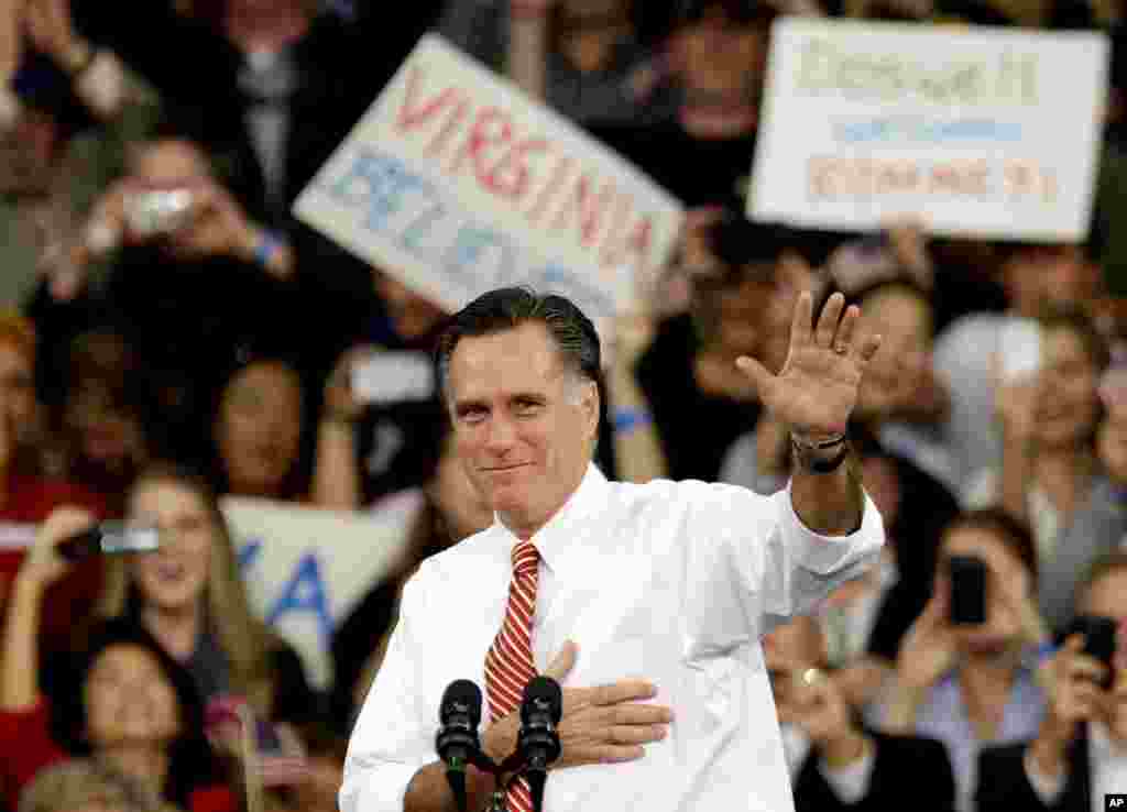Republican presidential candidate, former Massachusetts Gov. Mitt Romney gestures as he takes the stage for a campaign event at Meadow Event Park, Doswell, Va., November 1, 2012.