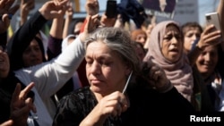 Women protest over the death of Mahsa Amini in Iran, in the Kurdish-controlled city of Qamishli