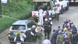Armed Guards Walk Toward Nairobi Hotel