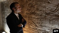 French President Emmanuel Macron visits the temple of Abu Simbel in southern Egypt, Jan. 27, 2019.