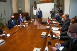 FILE - U.S. Special Envoy for the Horn of Africa Jeffrey Feltman, left, meets with Egyptian Foreign Minister Sameh Shoukry, third right, and their delegations, at the foreign ministry in Cairo, Egypt, May 5, 2021.