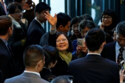 FILE - Taiwan President Tsai Ing-wen waves to supporters as she leaves a hotel for her return to Taiwan after her visit to Latin America in Burlingame, Calif., Jan. 14, 2017.
