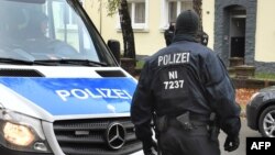 Policemen search an apartment building close to the mosque "Deutschsprachiger Islamkreis Hildesheim e.V." (German speaking Islam circle, DIK) in Hildesheim, central Germany, Nov. 8, 2016.