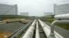 FILE - Pipelines running from the offshore docking station to four liquefied natural gas (LNG) tanks at the Dominion Resources Inc. Liquefied Natural Gas facility in Cove Point, Maryland, are seen in a June 13, 2003, photo.