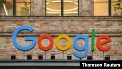 A view of a sign above the entrance of the Google office in Berlin