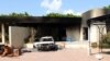 Burnt house, car inside U.S. embassy compound following overnight attack, Benghazi, Sept. 12, 2012.