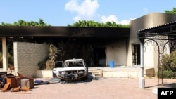 Burnt house, car inside U.S. embassy compound following overnight attack, Benghazi, Sept. 12, 2012.