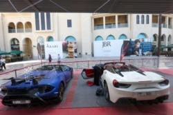 Luxury rental cars are displayed at the Jumeirah Beach Residence area in Dubai, United Arab Emirates, March 11, 2020.