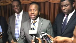 FILE - Senator Jean Renèl Senatus talks to reporters at the parliament in Port-au-Prince, Haiti.
