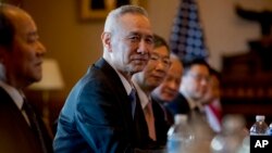 Chinese Vice Premier Liu He, center, accompanied by other Chinese officials, begins talks with U.S. Trade Representative Robert Lighthizer at the Executive Office building on the White House Complex, Jan. 30, 2019.