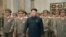 FILE - North Korean leader Kim Jong Un, with troops, visits the Kumsusan Palace on the anniversary of the armistice signing that ended the Korean War.
