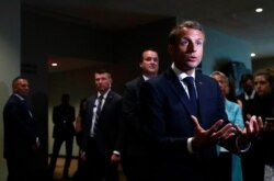French President Emmanuel Macron speaks to reporters on the sidelines during the 2019 United Nations Climate Action Summit at U.N. headquarters in New York City, New York, Sept. 23, 2019.
