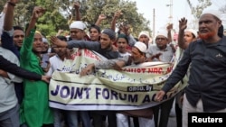 Demonstrators shout slogans during a protest against the Citizenship Amendment Bill, a bill that seeks to give citizenship to religious minorities persecuted in neighboring Muslim countries, and National Register of Citizens, in Kolkata, Dec. 9, 2019.