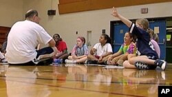 Coach Andy Stadnik of the Amateur Athletic Union and his basketball team talk about the importance of ethics in sports and life, Oct 2010