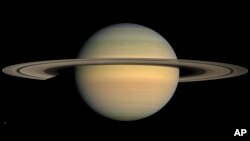 This July 23, 2008 image made available by NASA shows the planet Saturn, as seen from the Cassini spacecraft. A newly discovered a planet outside our solar system is 12 times the size of Jupiter.