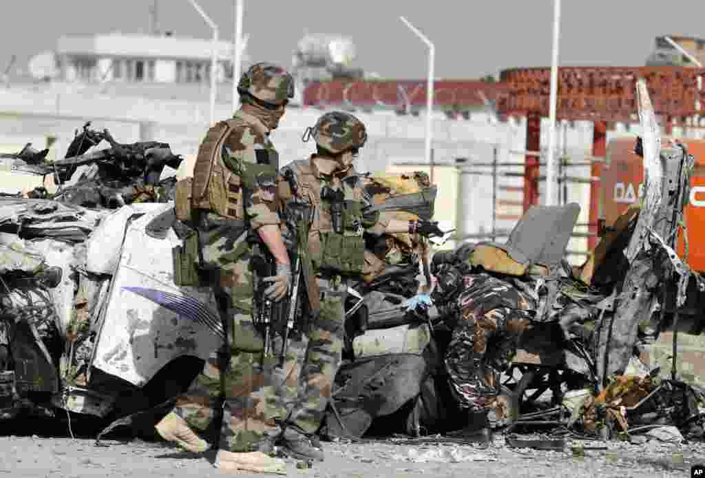 French soldiers arrive at the scene of a suicide bombing, Kabul, Afghanistan, September 18, 2012.