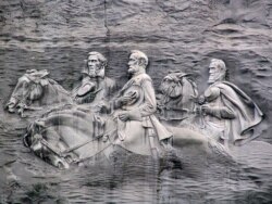 A rock carving in Stone Mountain, Georgia, depicts Confederate Robert E. Lee and Stonewall Jackson, two prominate generals, as well as Jeffereson Davis, the president of the Confederacy.