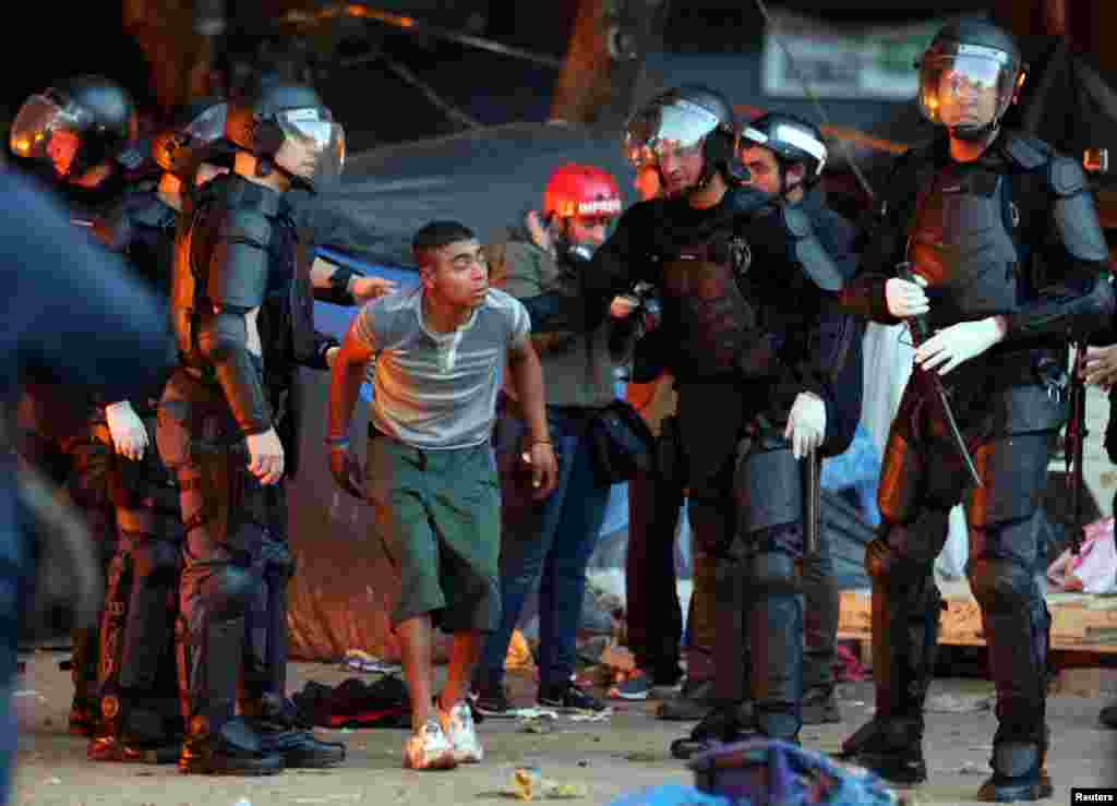 Riot police carry out an operation in a neighborhood known to locals as Cracolandia (Crackland), in downtown Sao Paulo, Brazil.