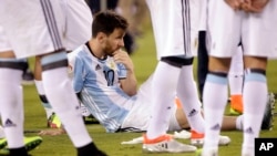 Argentina's Lionel Messi waits for trophy presentations after the Copa America Centenario championship soccer match, Sunday, June 26, 2016, in East Rutherford, N.J.