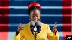 American poet Amanda Gorman reads a poem during the 59th Presidential Inauguration at the U.S. Capitol in Washington, Jan. 20, 2021.