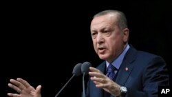 Le président turc Recep Tayyip Erdogan donne un discours à Ankara, le 19 mars 2018. 