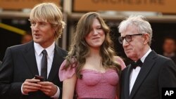 From left, actors Owen Wilson and Lea Seydoux stand with Director Woody Allen as they arrive for the screening of 'Midnight in Paris' and the opening ceremony, at the 64th international film festival, in Cannes, southern France, May 11, 2011.
