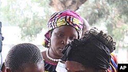 Congo election workers find voters' names on the rolls before they can cast their ballot, Nov. 28, 2011 Many voters complain their name did not appear at the station they registered in.