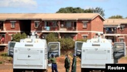 FILE - Police patrol during a 21-day nationwide lockdown called to help curb the spread of coronavirus disease, in Harare, Zimbabwe, April 3, 2020. 