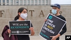 People gather to show their support for the 2020 Basic Income March at the Utah State Capitol, Sept. 19, 2020, in Salt Lake City.