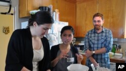 Culture Kitchen students learn the basics of Vietnamese cooking from instructor Linh Nguyen. 