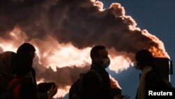 FILE - Delegates are seen at the U.N. Climate Change Conference (COP26), in Glasgow, Scotland, Nov. 12, 2021. 