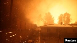 Firefighters battle flames during the Eaton Fire in Pasadena, Caliornia, Jan. 7, 2025.