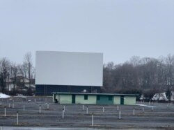 Empty Haar’s Drive-in lot and large movie screen. (Photo courtesy Haar's Drive-In Theater)