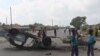 FILE - A burnt out vehicle lays on its roof in Lusaka, Zambia, April 7, 2016.