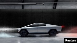 The Cybertruck, Tesla's first electric pickup truck, is seen in this undated handout picture released