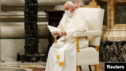 Pope Francis attends the vespers service in St. Peter's Basilica at the Vatican, Dec. 31, 2021. 