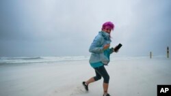 Courtney Watts of Tuscaloosa, Ala., moves off the beach at Gulf State Park, in Gulf Shores, Ala., Sept. 15, 2020.