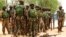 Soldiers stand during a parade in Baga village on the outskirts of Maiduguri, in the north-eastern state of Borno, Nigeria, May 13, 2013.