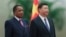Chinese President Xi Jinping, right, and Congo President Denis Sassou Nguesso listen to their national anthems during a welcoming ceremony inside the Great Hall of the People in Beijing, Sept. 5, 2018.
