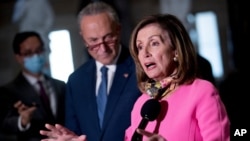 House Speaker Nancy Pelosi, accompanied by Senate Minority Leader Sen. Chuck Schumer, left, speak to reporters following a meeting with Treasury Secretary Steven Mnuchin and White House Chief of Staff Mark Meadows, Aug. 7, 2020.