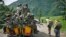 FILE - M23 rebels withdraw from the Masisi and Sake areas in eastern Congo, Nov 30, 2012.