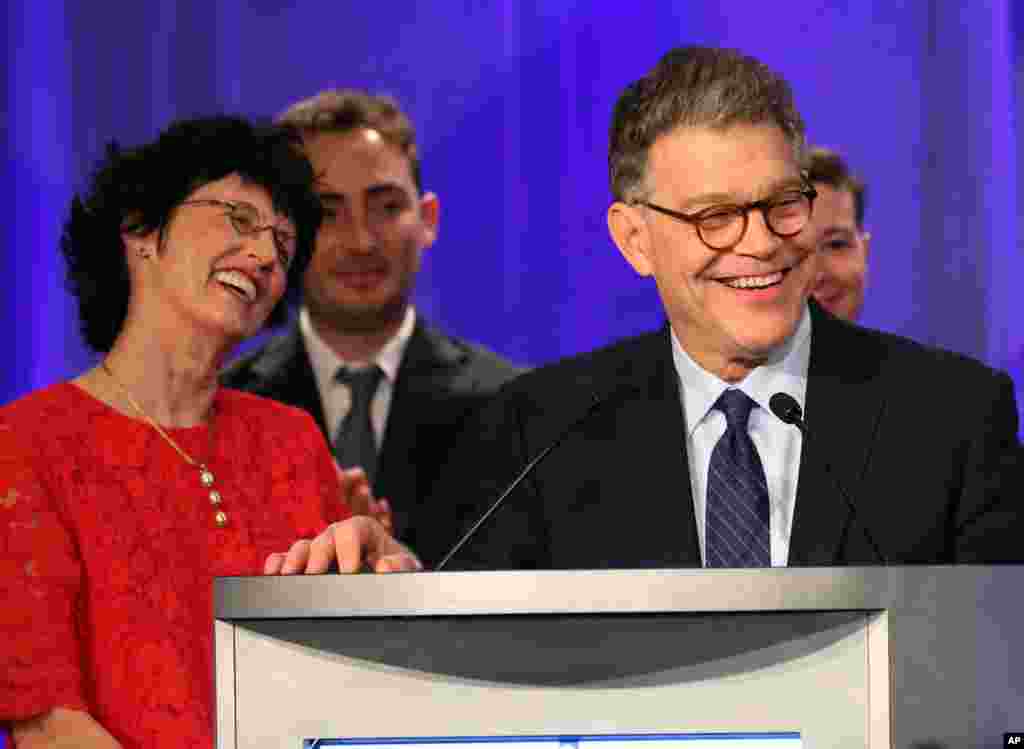 Sen. Al Franken, D-Minn., accompanied by his wife, Franni (left) and other relatives, addresses Democratic party night supporters after winning his Senate race against Republican Mike McFadden, in Minneapolis, Minnesota, Nov. 4, 2014. 